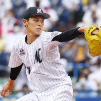 Marines starter Roki Sasaki pitches against the Lions on Sunday in Chiba. | KYODO
