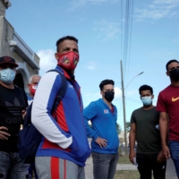 Players of Cuba's national baseball team wait to enter the U.S. Embassy in Havana on May 19. | REUTERS
