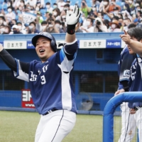 Seibu's Hotaka Yamakawa celebrates after hitting a ninth-inning home run against Yakult on Saturday at Jingu Stadium. | KYODO