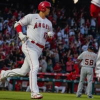 Los Angeles Angels designated hitter Shohei Ohtani jogs around the bases after hitting a two-run home run off Detroit Tigers relief pitcher Wily Peralta in the third inning at Angel Stadium in Anaheim, California, on Saturday. | USA TODAY / VIA REUTERS