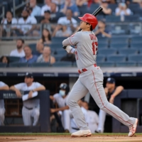 Angels designated hitter Shohei Ohtani hits a first-inning home run against the Yankees on Monday in New York. | USA TODAY / VIA REUTERS