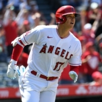 The Angels' Shohei Ohtani begins to round the bases after hitting a two-run home run against the Tigers at Angel Stadium on Sunday. | USA TODAY / VIA REUTERS