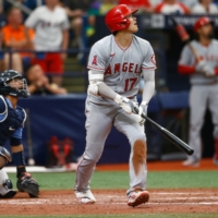 Los Angeles Angels designated hitter Shohei Ohtani hits a home run Sunday in the ninth inning against the Tampa Bay Rays, at Tropicana Field in St. Petersburg, Florida. | USA TODAY SPORTS / VIA REUTERS