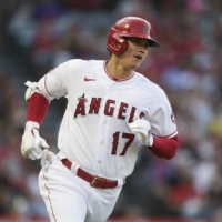 Los Angeles Angels designated hitter Shohei Ohtani runs to first after hitting a pop up on Friday at Angel Stadium. | USA TODAY / VIA REUTERS