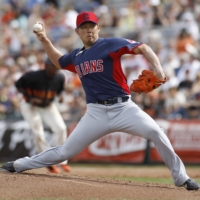 Daisuke Matsuzaka delivers a pitch against the San Francisco Giants in March 2013. | REUTERS