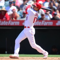 Los Angeles Angels designated hitter Shohei Ohtani hits a home run against the Boston Red Sox during the fifth inning at Angel Stadium on Wednesday. | GARY A. VASQUEZ / USA TODAY / VIA REUTERS
