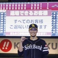 Kodai Senga poses for photos after the Hawks' victory over the Eagles in Sendai on Wednesday. | KYODO