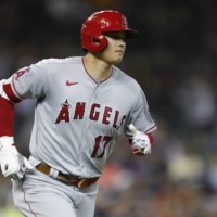 Shohei Ohtani rounds the bases after hitting a solo home run against the Tigers during the eighth inning of their game in Detroit on Wednesday. | USA TODAY / VIA REUTERS
