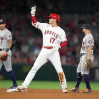 Los Angeles Angels designated hitter Shohei Ohtani reacts after hitting an RBI single in the eight inning on Friday. | USA TODAY / VIA REUTERS