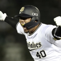 Orix's Seiichiro Oshita celebrates after driving in the game-winning run against the Marines on Tuesday in Kobe. | KYODO