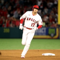 Angels designated hitter Shohei Ohtani rounds the bases after hitting his 43rd home run of the season on Saturday in Anaheim, California. | USA TODAY / VIA REUTERS