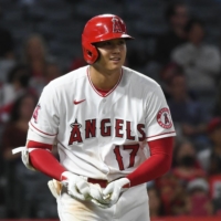 Los Angeles Angels designated hitter Shohei Ohtani reacts after being walked by the Seattle Mariners in the ninth inning on Friday. | USA TODAY / VIA REUTERS