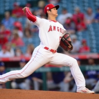 Los Angeles Angels starting pitcher Shohei Ohtani throws against the Texas Rangers on Friday. | USA TODAY / VIA REUTERS