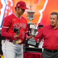 Angels two-way player Shohei Ohtani receives the team's MVP and best pitcher awards from owner Artie Morena on Saturday in Anaheim, California. | USA TODAY / VIA REUTERS