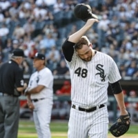 White Sox pitcher Mike Wright leaves the field after his ejection for intentionally hitting Angels batter Shohei Ohtani on Thursday in Chicago. | USA TODAY / VIA REUTERS