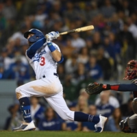 The Dodgers' Chris Taylor hits his third home run of the game during the seventh inning of Game 5 against the Braves on Thursday in Los Angeles. | USA TODAY / VIA REUTERS
