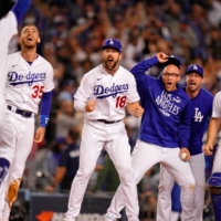 
OCT 6, 2021; LOS ANGELES, CALIFORNIA, USA; THE LOS ANGELES DODGERS CELEBRATE THE WALK-OFF TWO RUN HOME RUN HIT BY LEFT FIELDER CHRIS TAYLOR (3) AGAINST THE ST. LOUIS CARDINALS DURING THE NINTH INNING AT DODGER STADIUM. THE LOS ANGELES DODGERS WON 3-1. MANDATORY CREDIT: ROBERT HANASHIRO-USA TODAY SPORTS