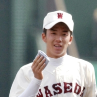 Yuki Saito a national sensation after using a blue handkerchief to wipe away sweat during the National High School Baseball Championship in 2006 at Koshien Stadium in Nishinomiya, Hyogo Prefecture. | KYODO