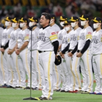 Hawks manager Kimiyasu Kudo greets fans after the team's final home game of the season on Oct. 21 in Fukuoka. | KYODO
