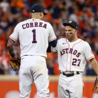 Houston Astros second baseman Jose Altuve and shortstop Carlos Correa celebrate after the team's Game 1 win over the Boston Red Sox on Friday. | USA TODAY / VIA REUTERS
