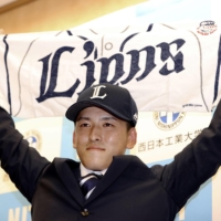 Top pitching prospect Chihiro Sumida poses after the Seibu Lions won the right to negotiate with the left-hander at Nippon Professional Baseball's amateur draft on Monday. | KYODO