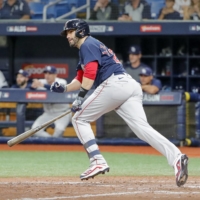 Boston Red Sox designated hitter J.D. Martinez hits a double against he Tampa Bay Rays on Friday. | USA TODAY / VIA REUTERS