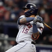 Astros catcher Martin Maldonado hits an RBI double against the Braves during the seventh inning of Game 5 in the World Series in Atlanta on Sunday. | USA TODAY / VIA REUTERS