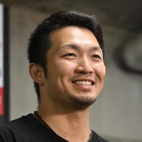 Carp outfielder Seiya Suzuki speaks to reporters in Hiroshima on Tuesday. | KYODO