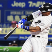 The Marines' Leonys Martin hits a two-out, game-tying solo home run against the Eagles in the seventh inning at Zozo Marine Stadium on Sunday. | KYODO