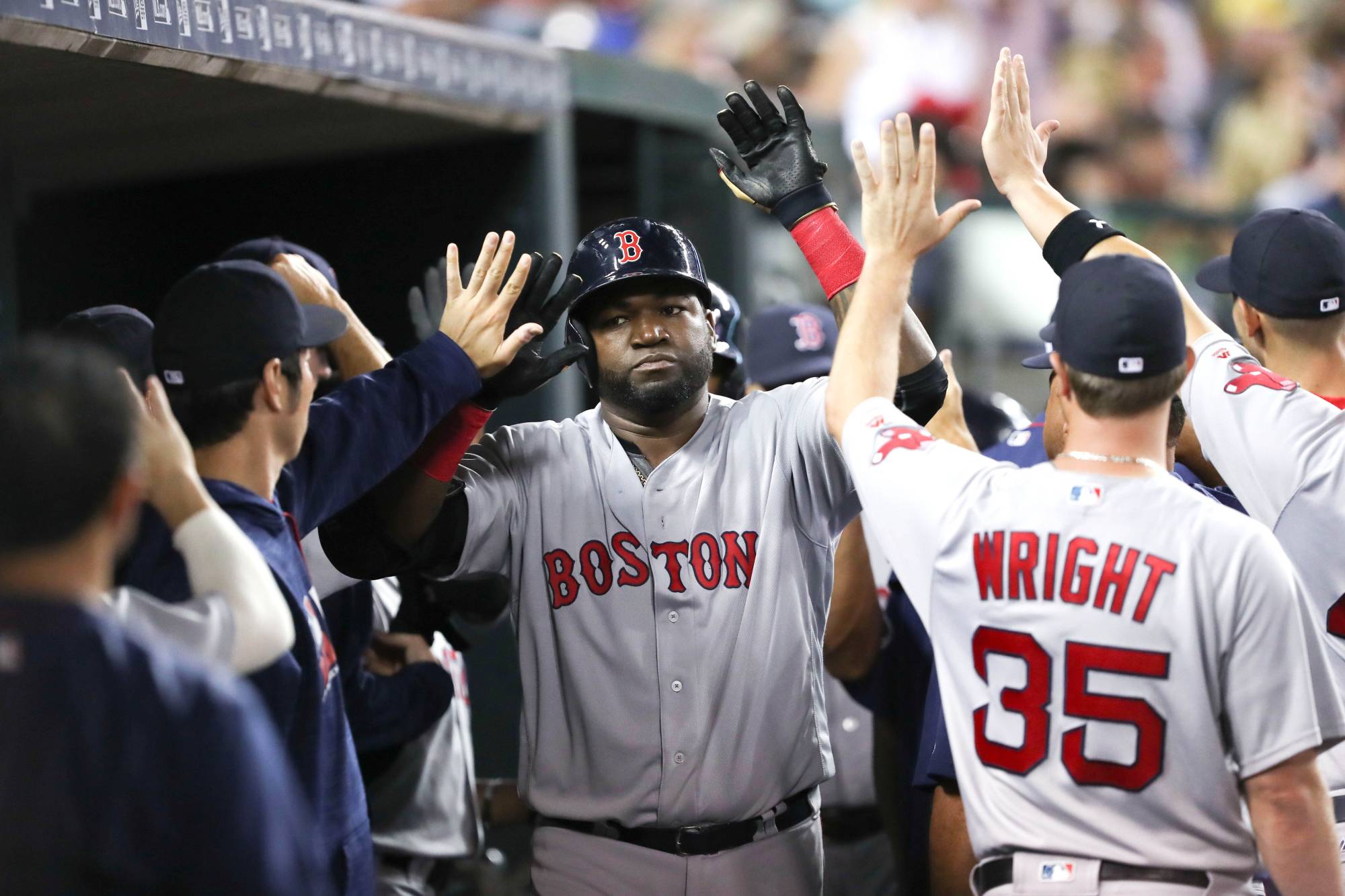Red Sox designated hitter David Ortiz celebrates with teammates in the dugout after hitting a home run against the Tigers at Comerica Park in Detroit on Aug. 20, 2016. | USA TODAY SPORTS / VIA REUTERS
