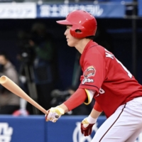 Carp starter Masato Morishita had two singles and a double during Hiroshima's win over DeNA on Saturday. | KYODO