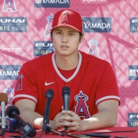 Angels star Shohei Ohtani speaks to reporters at the team's spring training facility in Tempe, Arizona, on Tuesday. | KYODO