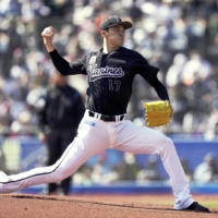 Lotte pitcher Roki Sasaki throws a perfect game against the Buffaloes in Chiba on Sunday. | KYODO