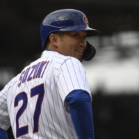 Cubs right fielder Seiya Suzuki reacts after being walked by the Brewers in Chicago on Thursday. | USA TODAY / VIA REUTERS