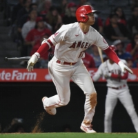 The Angels' Shohei Ohtani singles against the Guardians in the bottom of the eighth in Anaheim, California, on Wednesday. | USA TODAY / VIA REUTERS