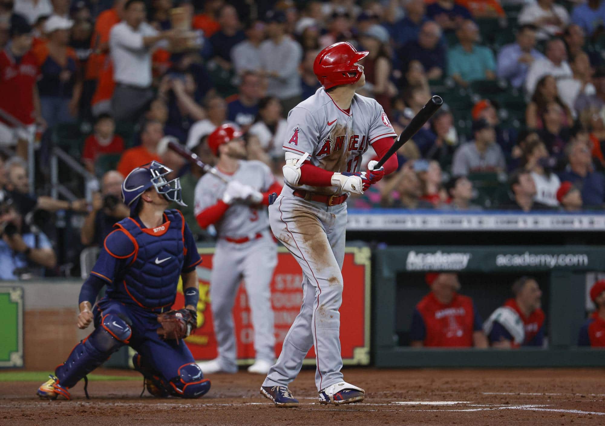 Los Angeles Angels' starting pitcher Shohei Ohtani (right) hits an RBI double during the first inning of a game against the Houston Astros at Minute Maid Park, in Houston, on Wednesday. | USA TODAY / VIA REUTERS