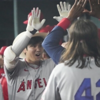 Los Angeles Angels designated hitter Shohei Ohtani celebrates with teammates after his second home run of the game on Friday at Globe Life Field in Arlington, Texas. | USA TODAY / VIA REUTERS
