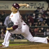 Eagles right-hander Masahiro Tanaka pitches against the Marines in Sendai on Tuesday. | KYODO