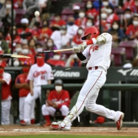 Carp pinch-hitter Shosei Nakamura flies out to end the team's draw against the Swallows in Hiroshima on Sunday. | KYODO
