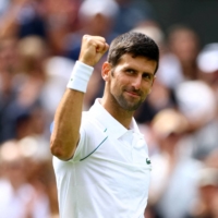 Novak Djokovic celebrates after his win over Thanasi Kokkinakis during the second round at Wimbledon in London on Sunday | REUTERS