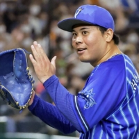 BayStars pitcher Haruhiro Hamaguchi leaves the field after the final out of the sixth against the Giants at Tokyo Dome on Saturday. | KYODO