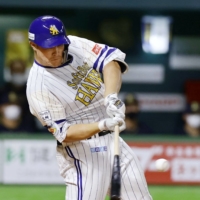 The Hawks' Richard Sunagawa hits a home run against the Buffaloes during the fourth inning in Fukuoka on Wednesday. | KYODO