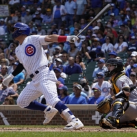 Cubs right fielder Seiya Suzuki hits a double against the Pirates in Chicago on Tuesday. | USA TODAY / VIA REUTERS