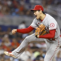 Angels starter Shohei Ohtani reacts after striking out the Marlins' NickFortes to end the seventh inning in Miami on Wednesday. | KYODO