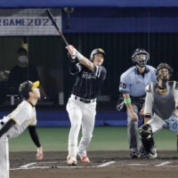 The Pacific League's Yuki Yanagita hits a home run during the sixth inning in Game 2 of the NPB All-Star Series in Matsuyama on Wednesday. | KYODO