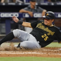 The Pirates' Yoshitomo Tsutsugo scores against the Marlins in Miami on July 14. | USA TODAY / VIA REUTERS