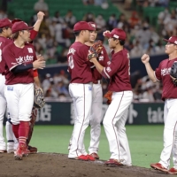 Rakuten players celebrate their win over SoftBank at Fukuoka's PayPay Dome on Sunday. | KYODO