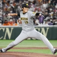 Tigers starter Shintaro Fujinami pitches against the Giants at Tokyo Dome on Saturday. | KYODO