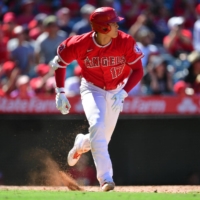 Shohei Ohtani hits an RBI single against the Twins during the Angels' win in Anaheim, California, on Sunday. | USA TODAY / VIA REUTERS