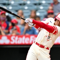 The Angels' Shohei Ohtani hits a solo home run against the Athletics during their game at Angel Stadium in Anaheim, California, on Thursday. The Athletics won 8-7. | USA TODAY / VIA REUTERS